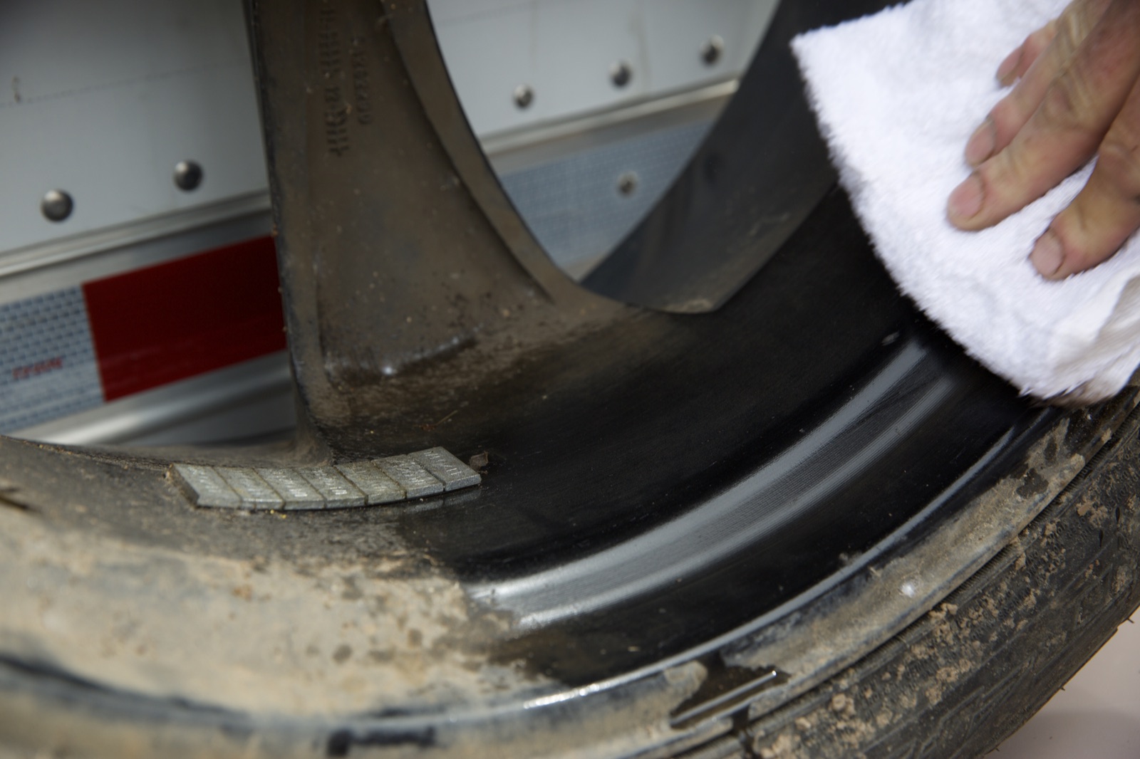 Wiping the wheel-weight bond area clean